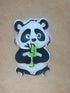 Pochoir en Mylar  représentant panda gourmand qui mange un bamboo
